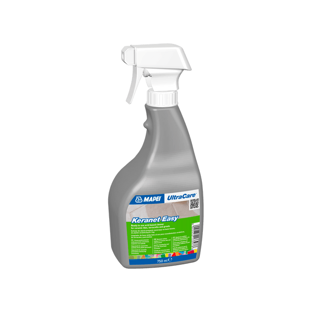 Spray bottle of MAPEI UltraCare KeraNet Easy cleaner on a dark background.