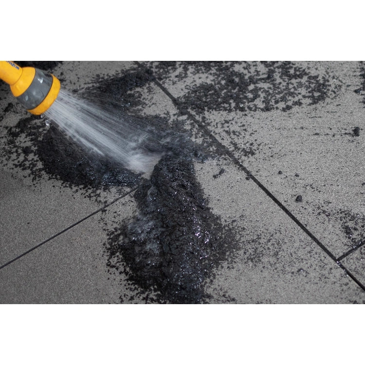A container of EASYJoint Select Carbon paving joint compound with a color sample.