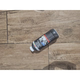 Bottle of porcelain cleaner and sanitiser for tiles and paving.