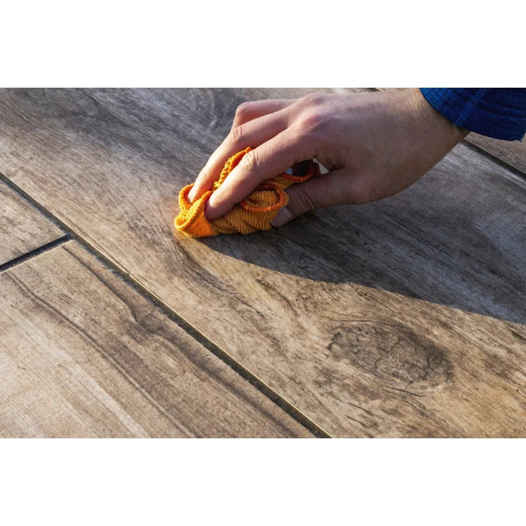 Bottle of porcelain cleaner and sanitiser for tiles and paving.