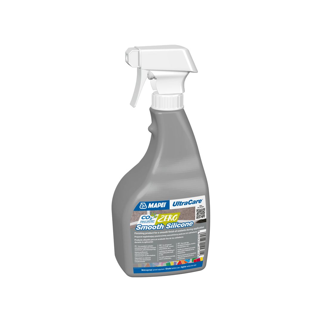 A spray bottle of UltraCare CO2 Zero Smooth Silicone sealant on a black background.