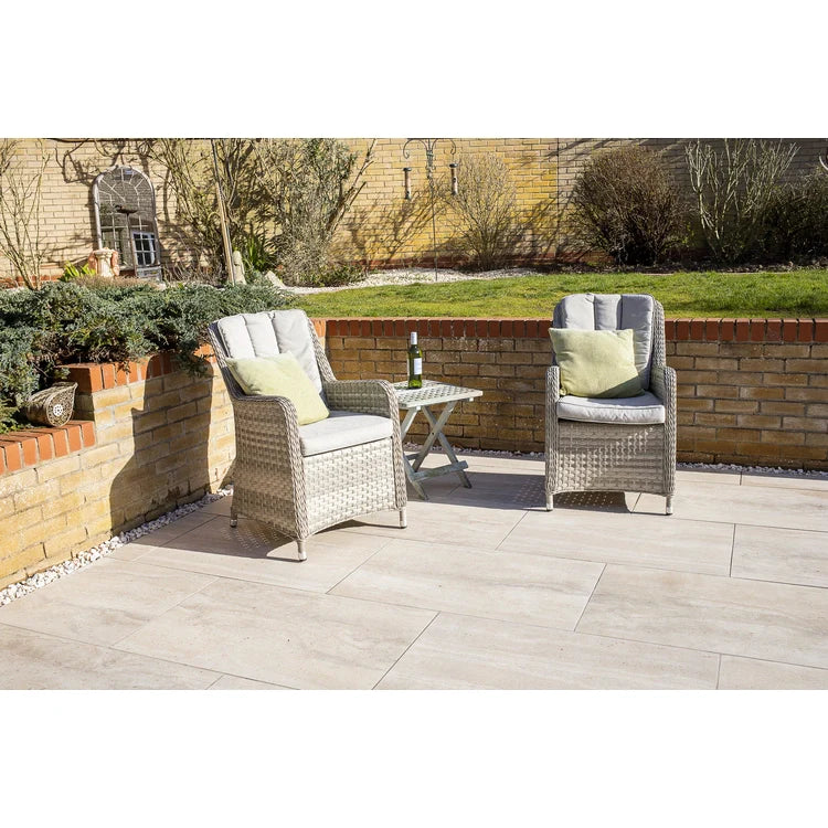 A bucket of EASYGrout for porcelain and ceramic paving with a color sample on the corner.