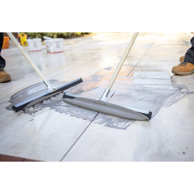 A bucket of EASYGrout for porcelain and ceramic paving with a color sample on the corner.