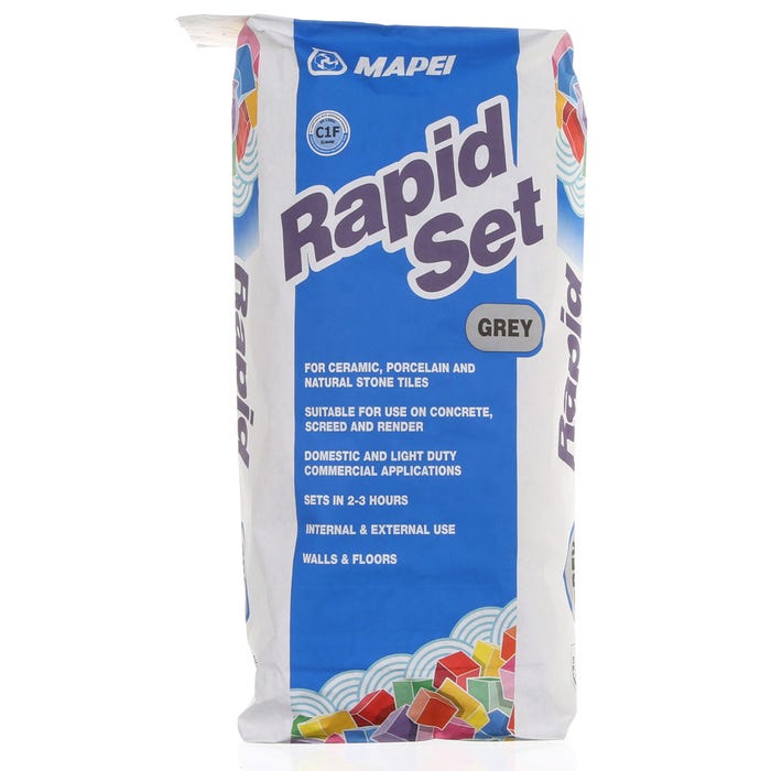 A bag of Mapei Rapid Set tile adhesive in grey color for walls and floors.